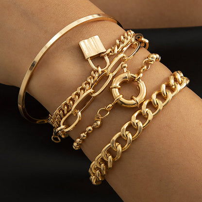 LAYERED GOLD BRACELETS